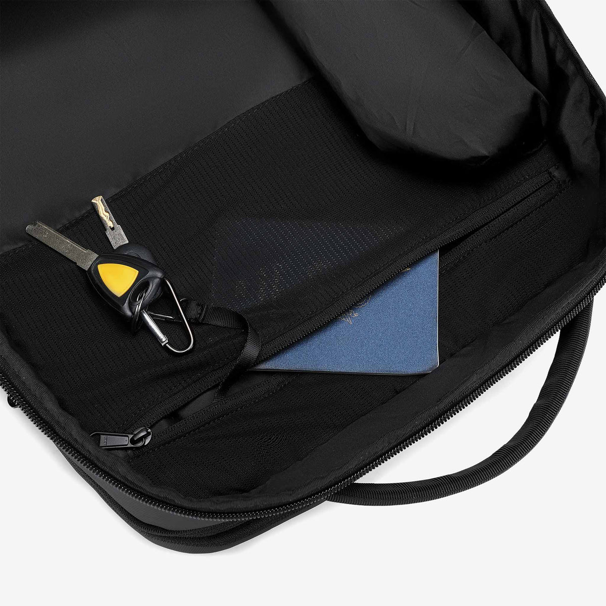 Hidden RFID-protected passport pocket with key clip