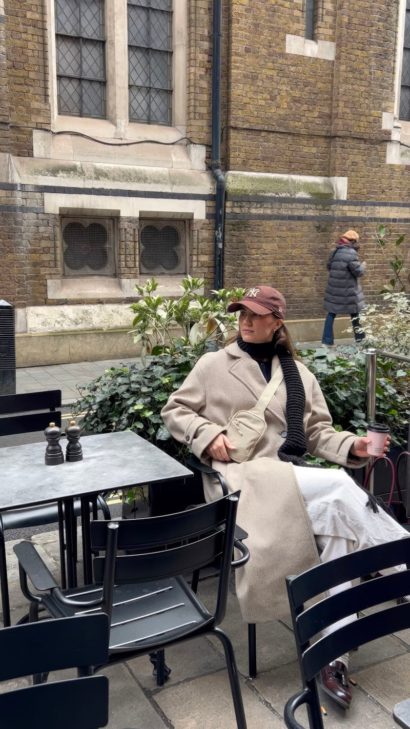 Woman wearing the Travel Sling Bag 2.0